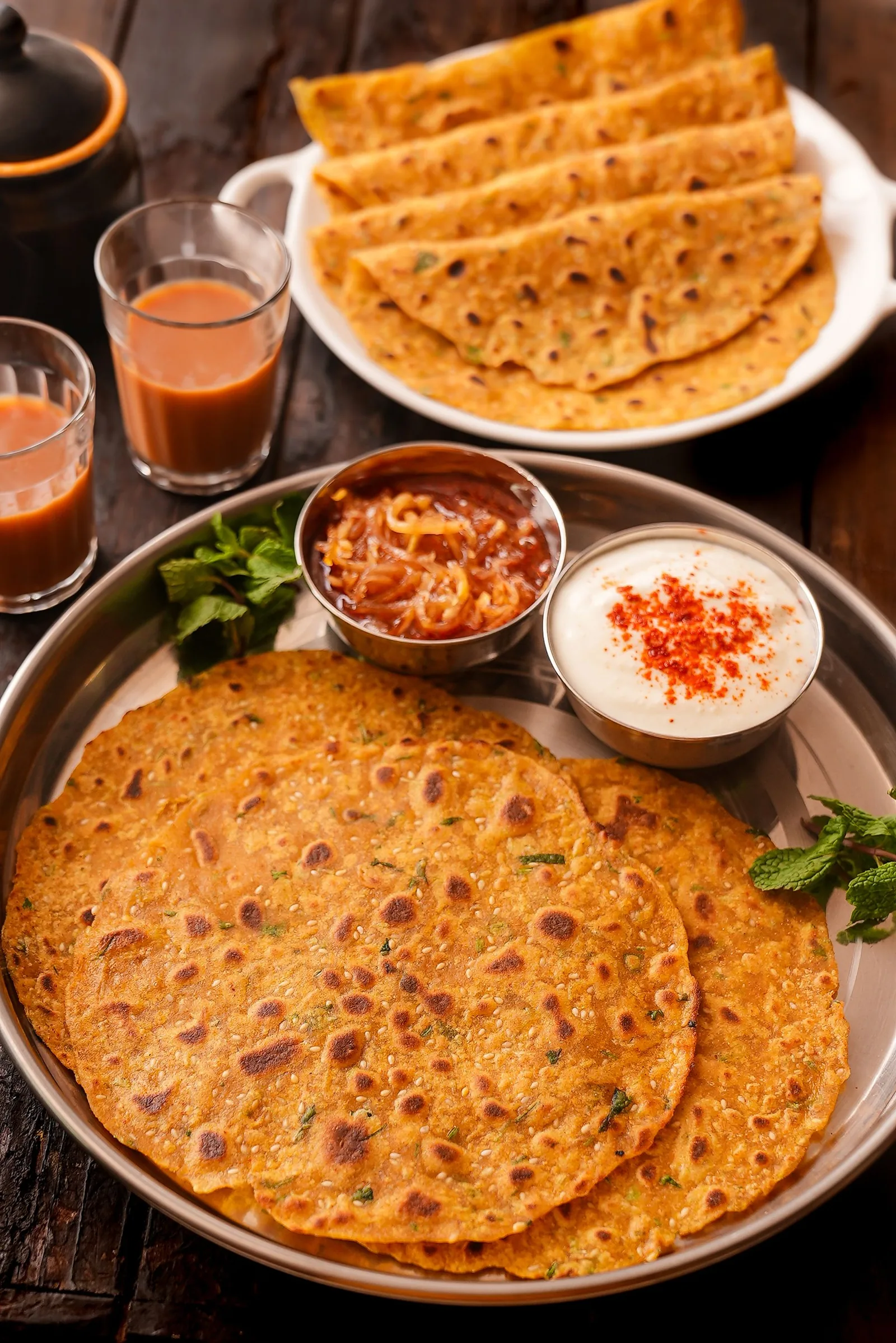 Parantha served with chutneys at a live parantha stall